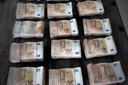 Ruim 150.000 euro en twee vuurwapens aangetroffen in onderzoek naar spookbewoning Barendrecht